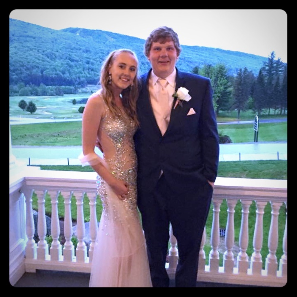 Sheer, hand beaded, nude color prom gown.